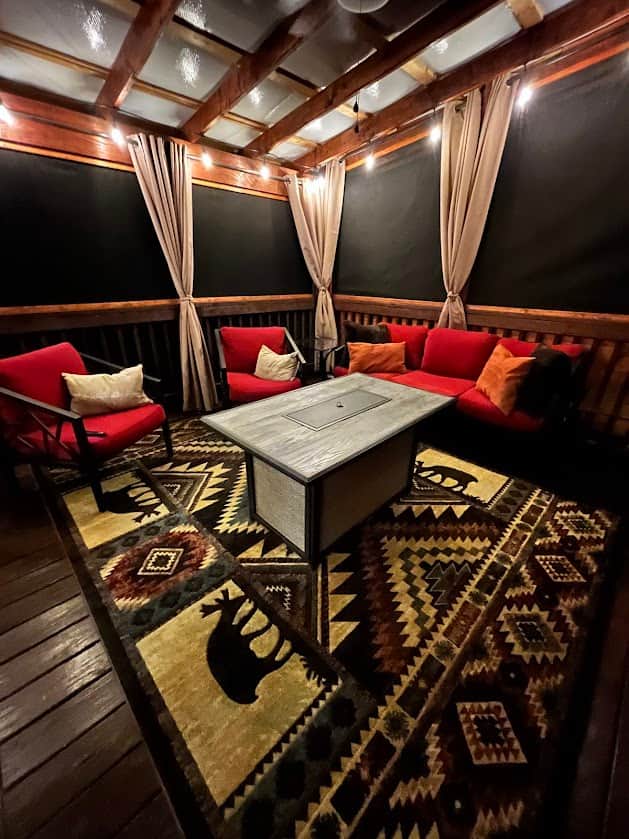 Screened-in back porch seating area.