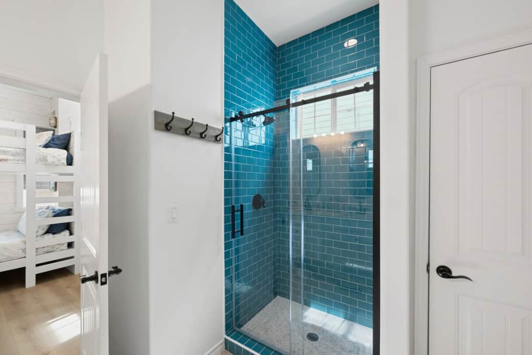 Jack and Jill shared bathroom with bedroom 2 and the bunk room. Dual vanity, closet and walk in shower. 