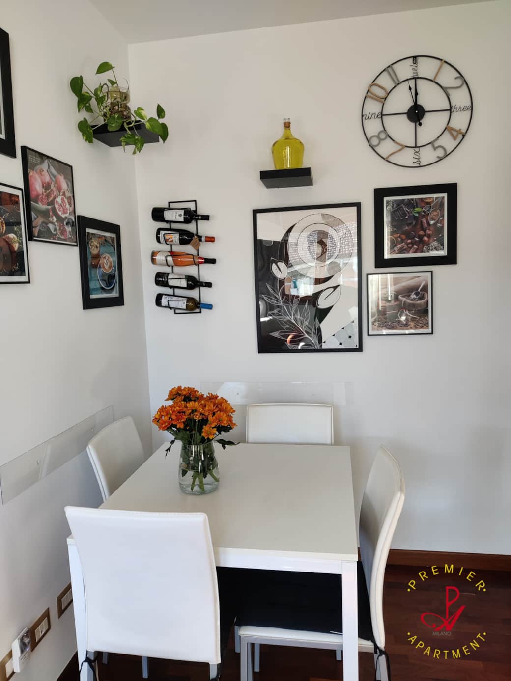 Dining area with wine selection decorated with paintings