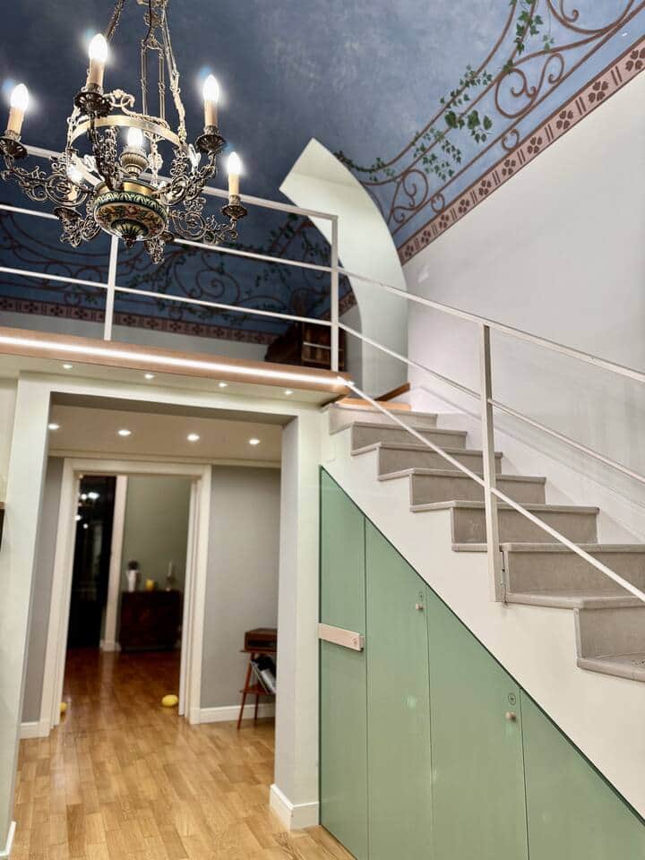 The heart of the 120 sq meter apartment, an open plan kitchen and dining area, with a staircase leading up to the mezzanine where guests will find a workspace, a barcart and a workout area with a yoga mat, yoga wheel, weights and other gym equipment. The heart of the 120 sq meter apartment, an open plan kitchen and dining area, with a staircase leading up to the mezzanine where guests will find a workspace, a barcart and a workout area with a yoga mat, yoga wheel, weights and other gym equipment.