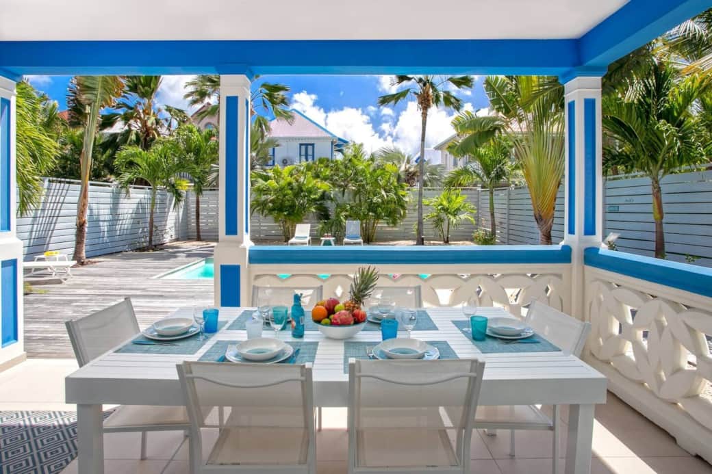 Dining table on the terrace overlooking the pool Tukan 