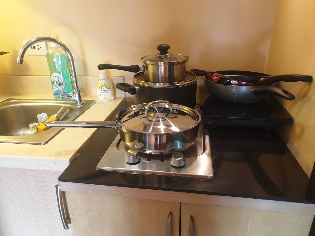 Fully equipped kitchen with electric stove and exhaust, refrigerator, and microwave oven. Have questions about our amenities? Send us a message for more details!