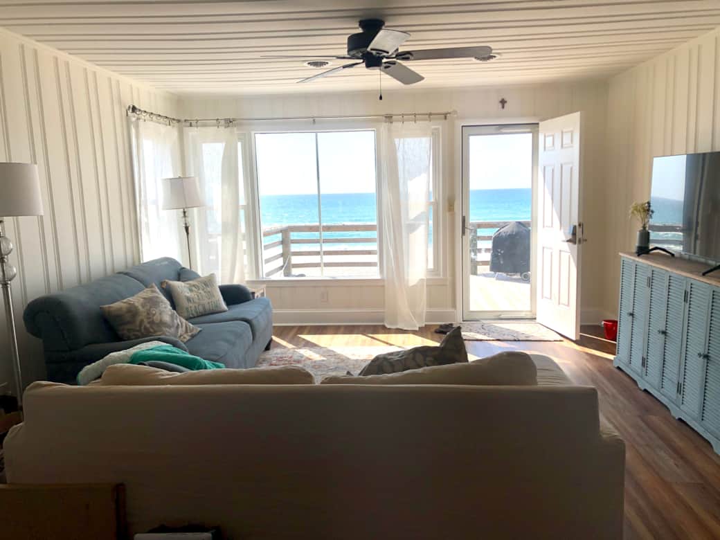 Living room with views of ocean.