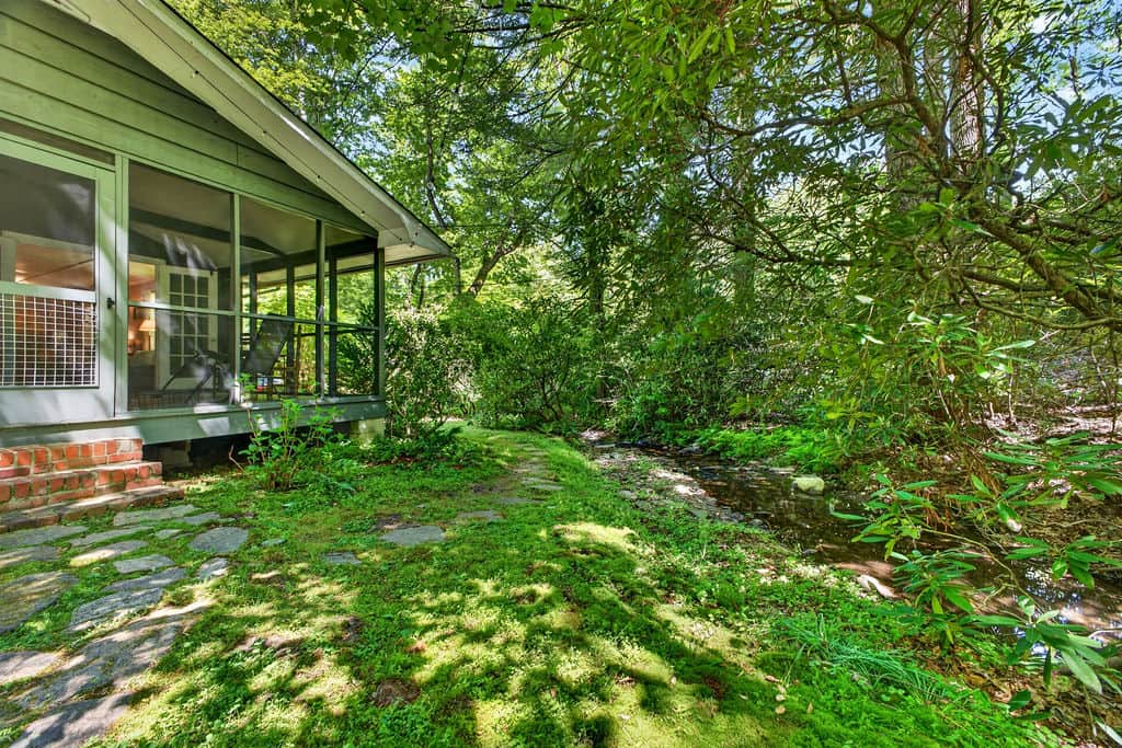 The creek is 10 feet from the screened in porch