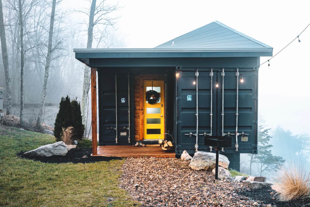 A cheerful yellow door offers a warm welcome to The Hangar.