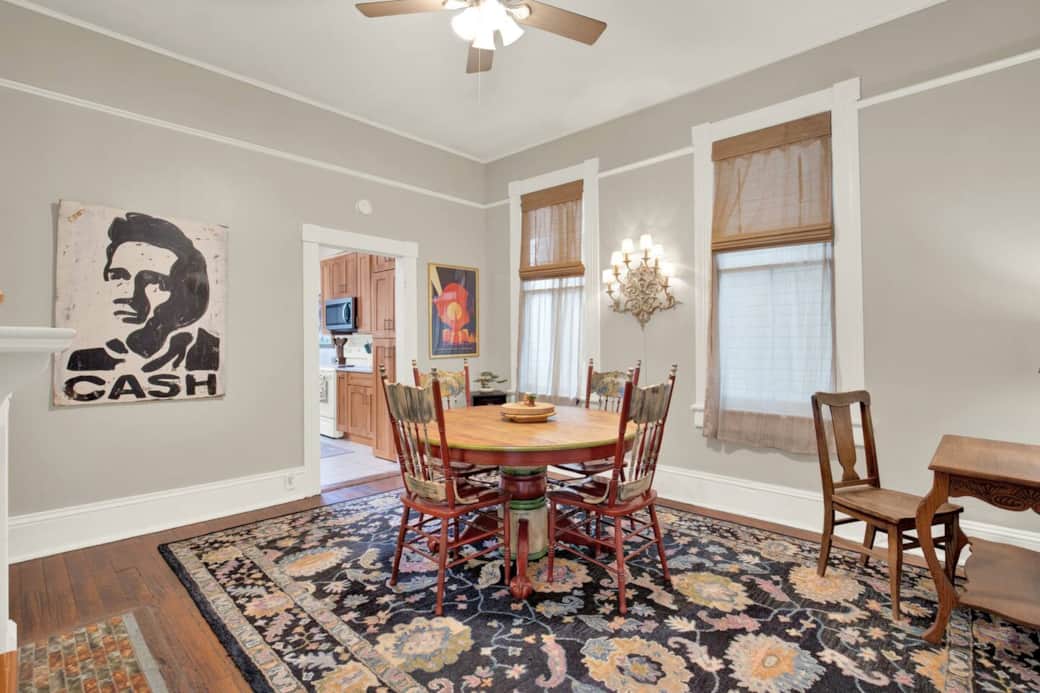 Dining table that comfortably seats four, along with a convenient desk—perfect for catching up on work or emails.
