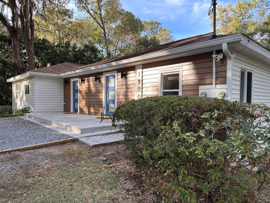 Exterior Front NORTHSIDE view.  This is a 2 unit property.  Everything is private for guests no sharing of living areas. Parking, front patio, back deck and yard are shared areas.