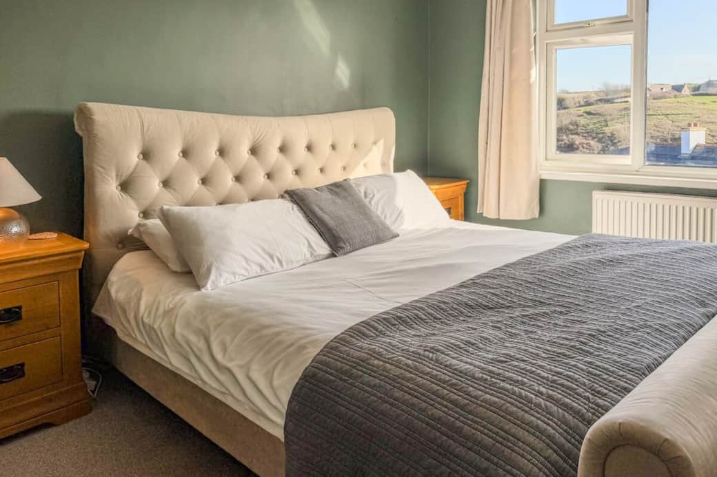 This super king bedroom is super comfortable with views of the village and countryside from your bed. 
