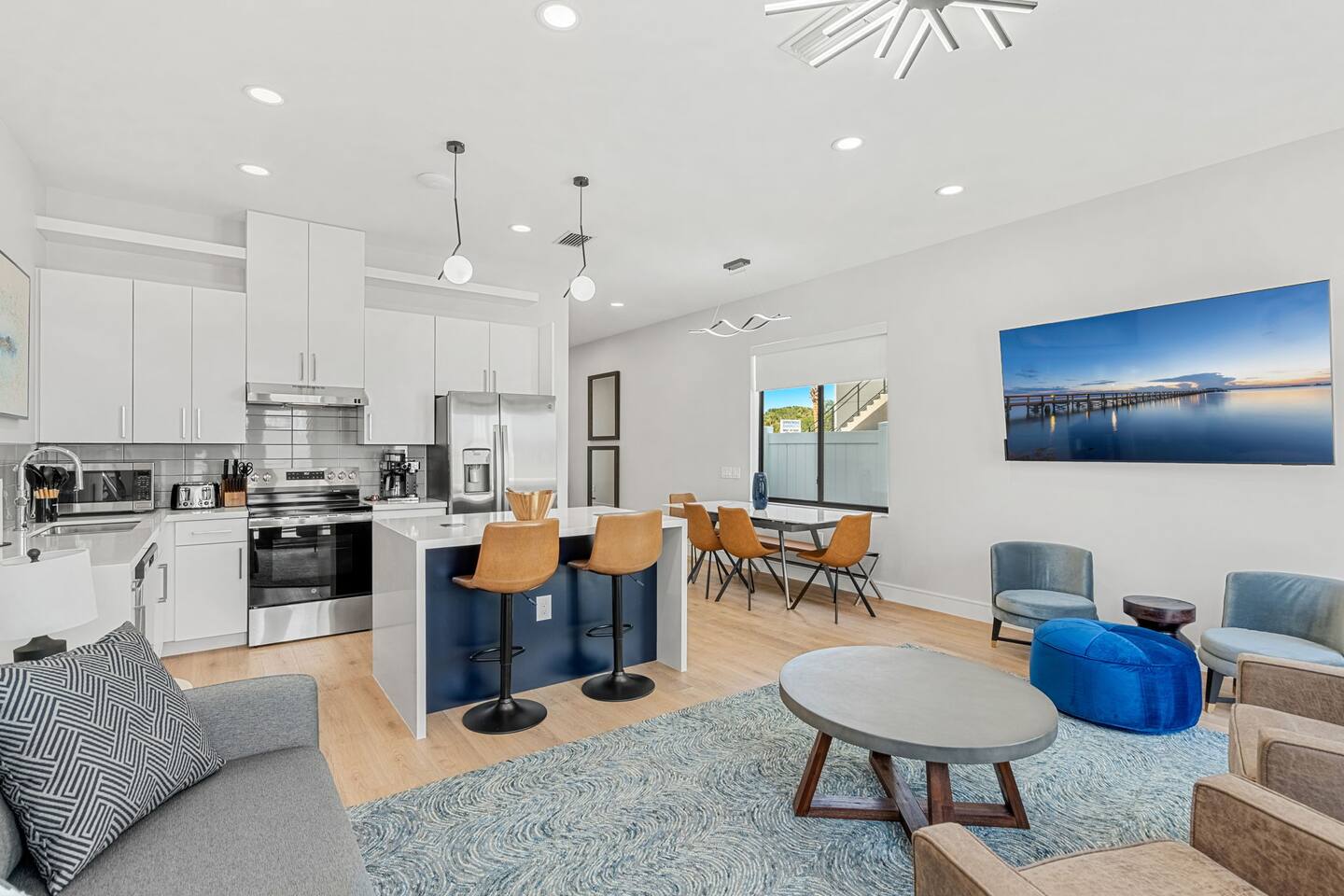 Enjoy a meal in the open kitchen and dining area, designed for seamless gatherings.
