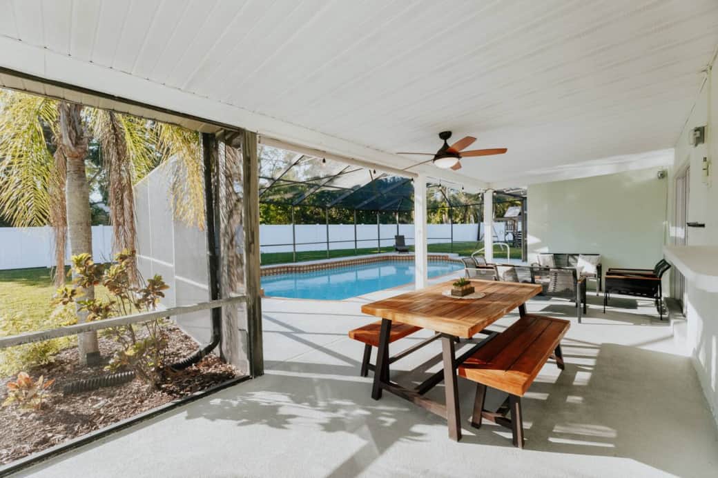 Dining setup on the screened-in veranda Dining setup on the screened-in veranda