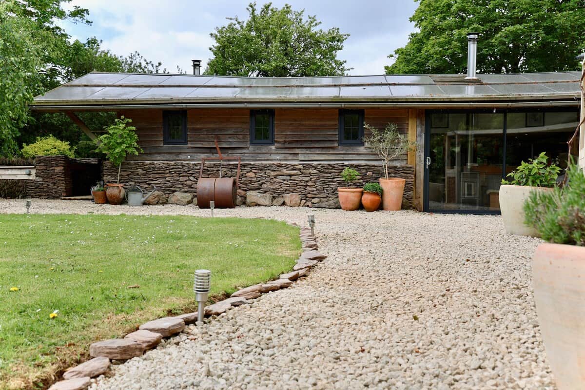 Outdoor garden leading to the patio doors to the lounge