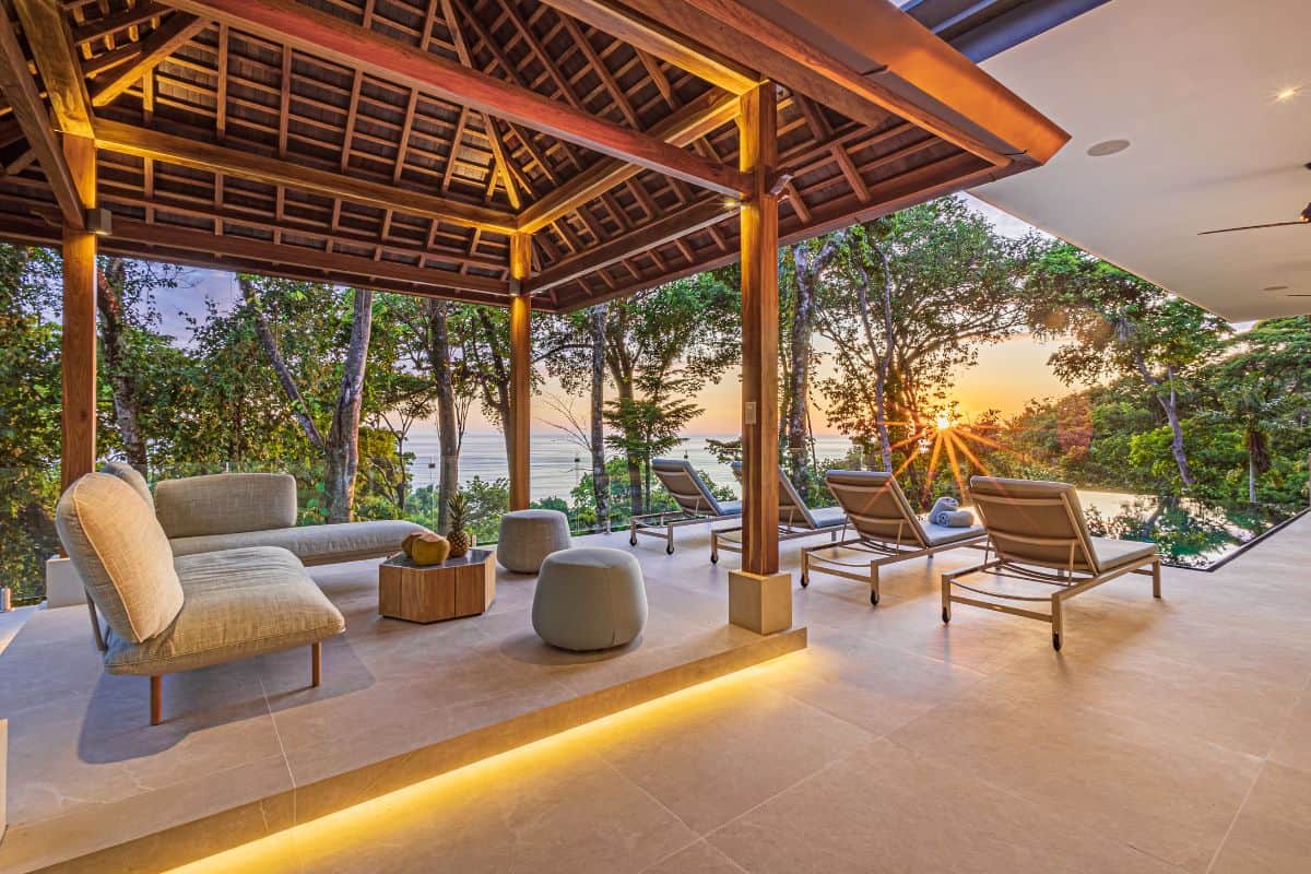 Balinese-style gazebo at Villa Sueño with ocean views at sunset.