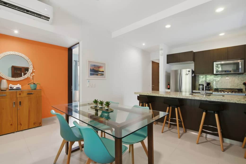 Enjoy meals together in the modern dining area with seating for 4, perfectly positioned next to the kitchen island for easy entertaining and relaxed gatherings.