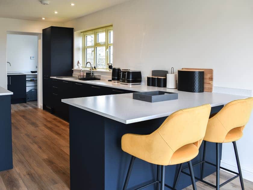 Breakfast bar and kitchen at Awel y Môr