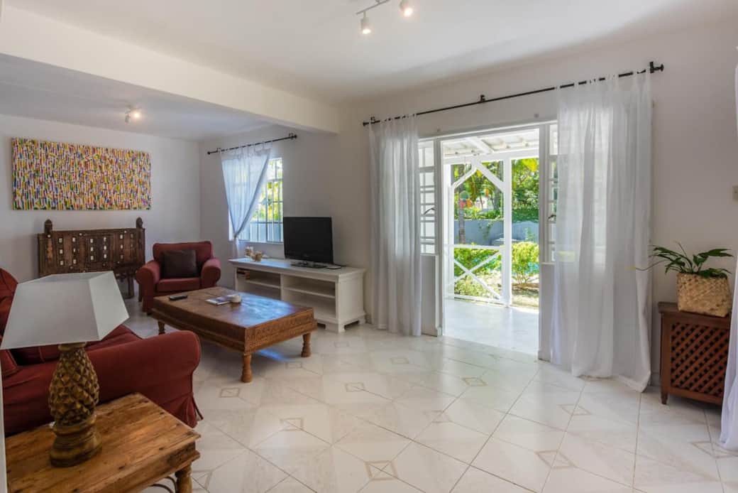 Living room overlooking the garden and pool