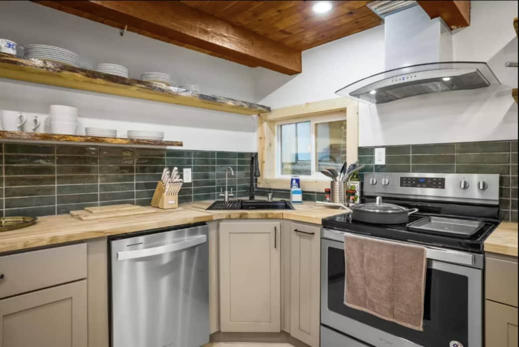 Easy-to-use kitchen with full cookware, dishwasher, and plenty of space for preparing family meals and snacks.