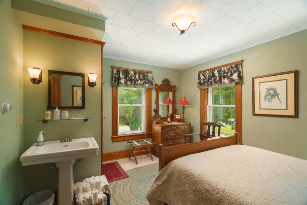 Windows showcase maples and changing foliage around the farmhouse. Windows showcase maples and changing foliage around the farmhouse.