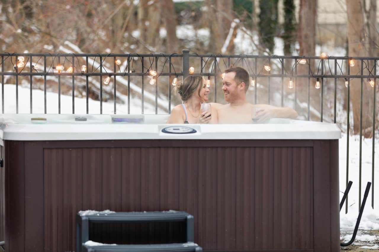 Relax in the hot tub surrounded by snowflakes for the perfect winter retreat!