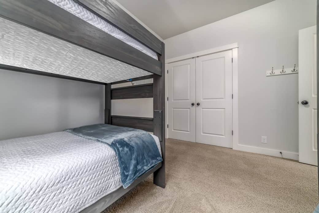 Bedroom complete with 4 single beds

Open shelving in closet to store your belongings 

