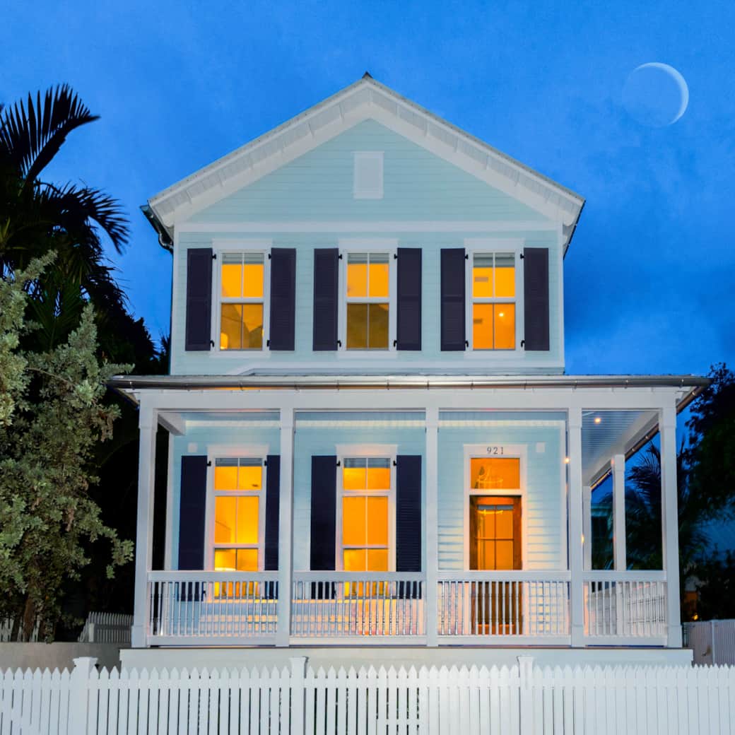 Classic Old Town Key West exterior with wraparound porches, tropical landscaping, and gated parking Classic Old Town Key West exterior with wraparound porches, tropical landscaping, and gated parking