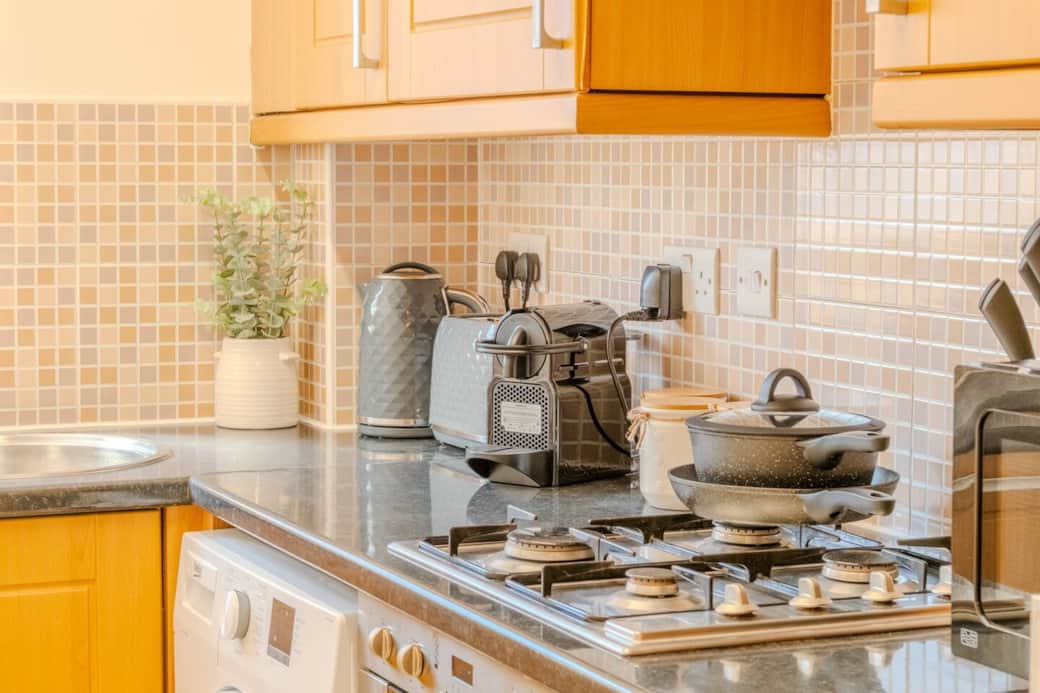 Kitchen with coffee machine, kettle, toaster, micrwave