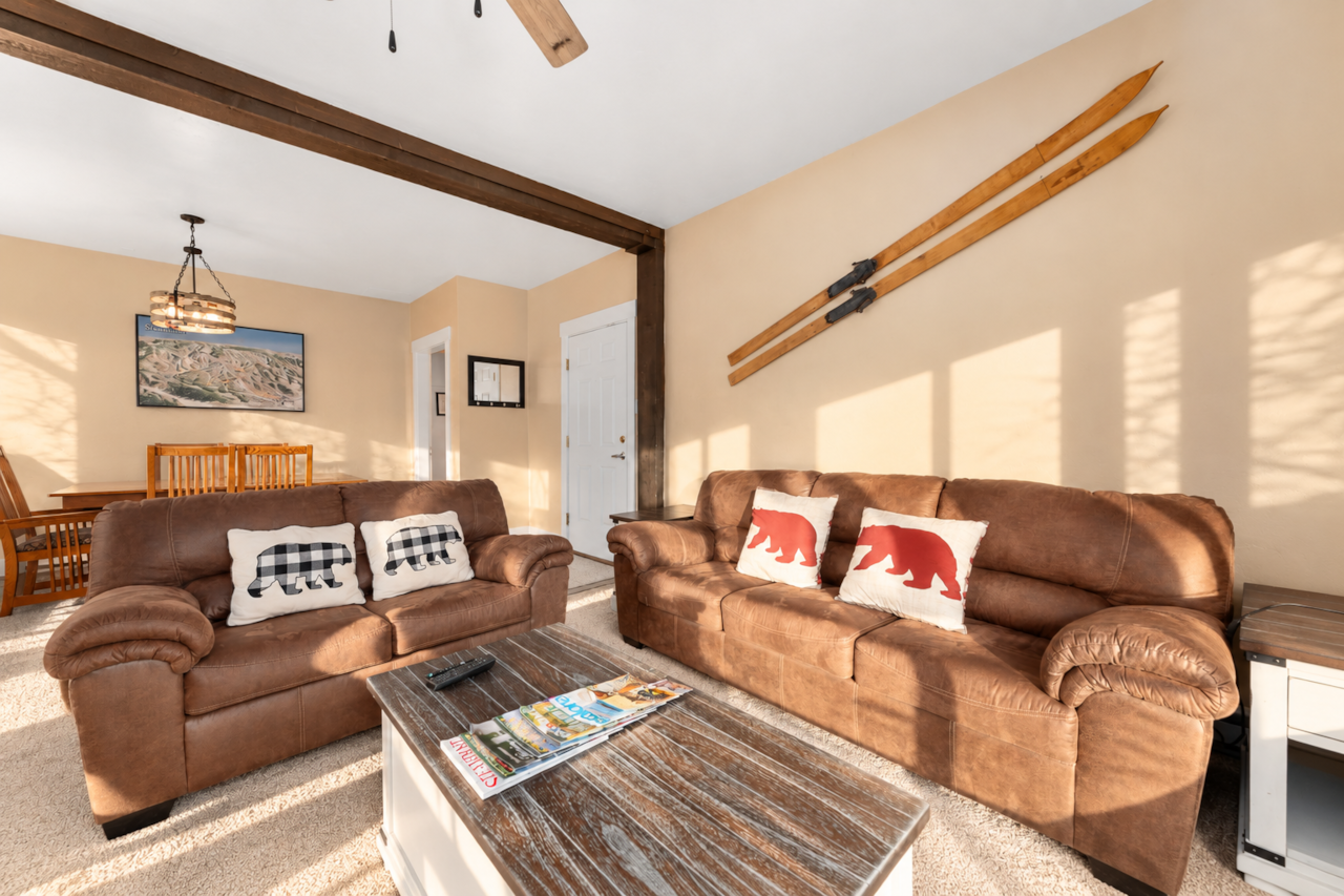 Relax in this inviting Steamboat vacation rental with cozy seating and snowy mountain views.