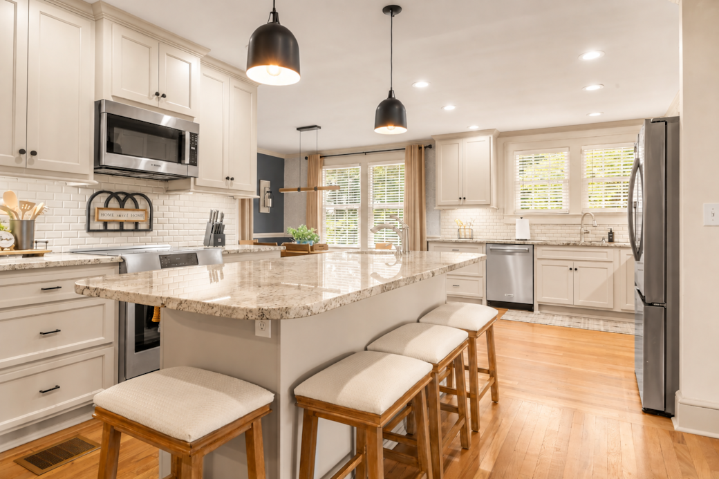 Open-Concept Kitchen with Oversized Island for Cooking and Gathering Open-Concept Kitchen with Oversized Island for Cooking and Gathering