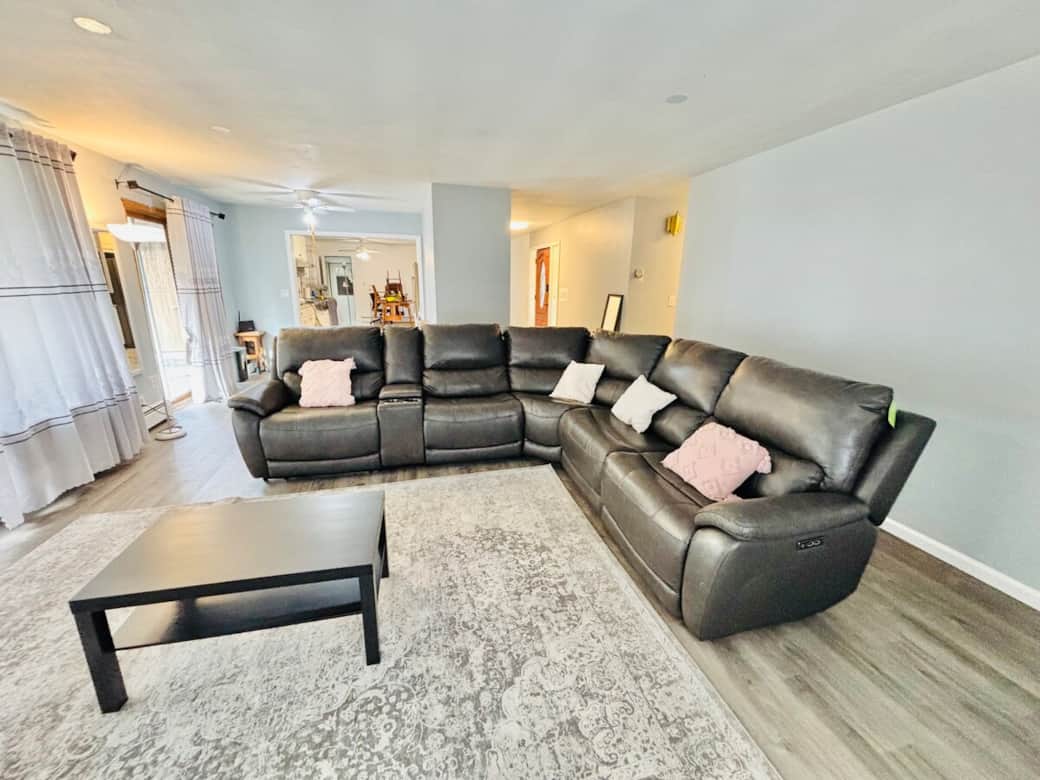 Open concept living area that flows into kitchen.