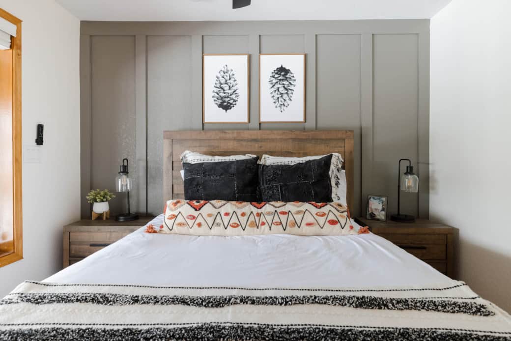 The third bedroom has a queen bed and view of the deck.