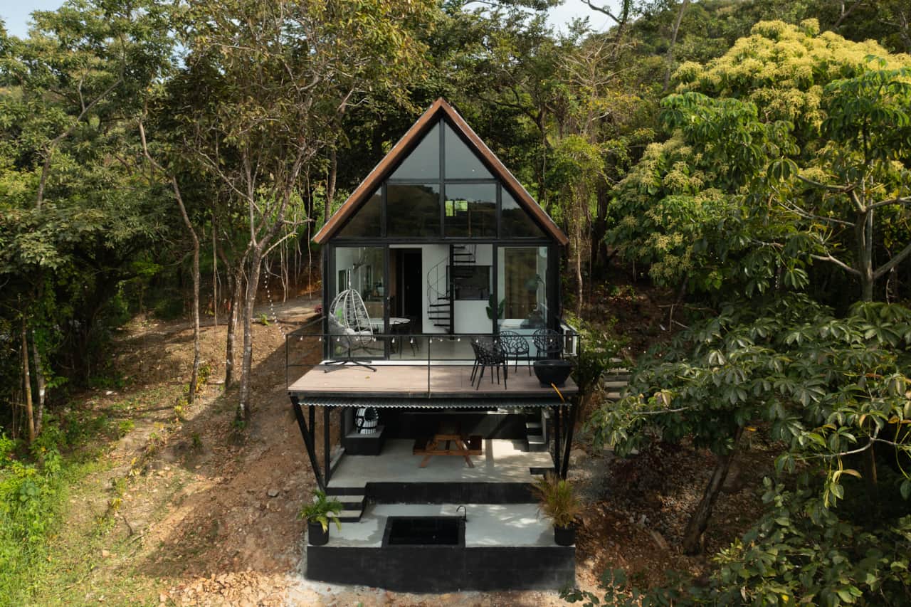 Nestled in the jungle, our iconic Scandinavian cabin in Panama features a deck and plunge pool.