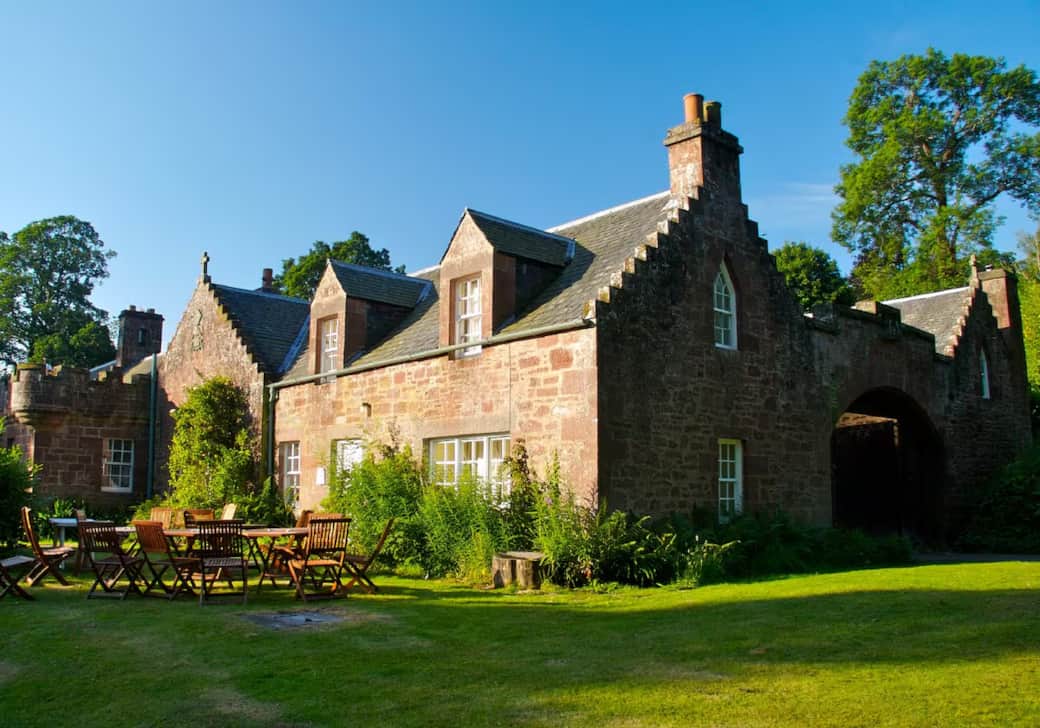 This is the front of Redwood Cottage, with a lawn and seating area for the summer months