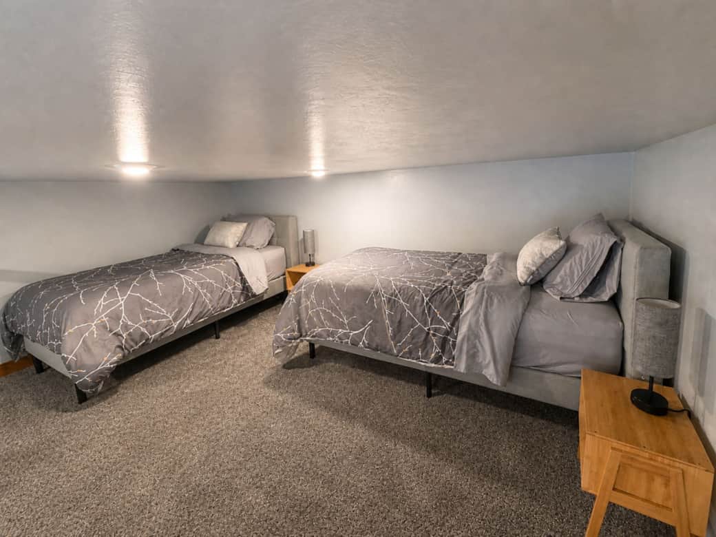 Airy view of the loft sleeping area which overlooks the main level in the Black Hills, SD.
