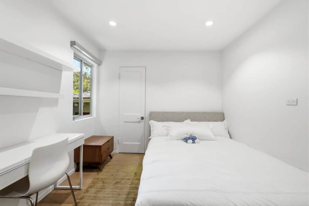 Bedroom with queen bed and dedicated workspace for quiet work or study. Bedroom with queen bed and dedicated workspace for quiet work or study.