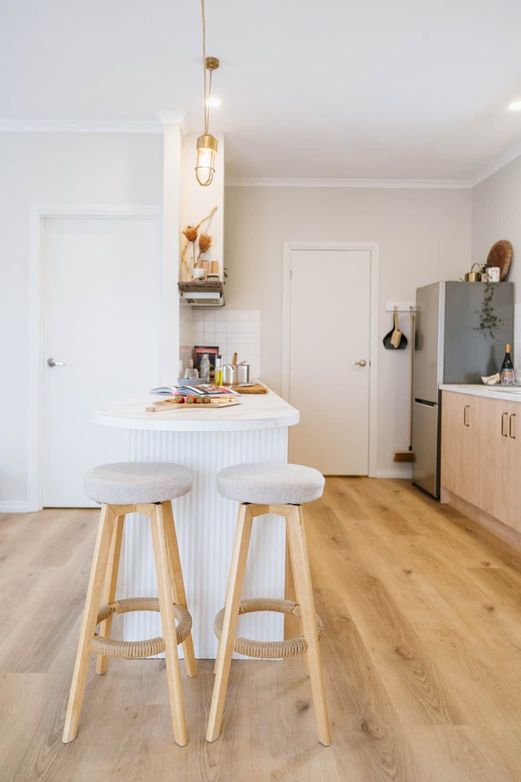 A bright functional kitchen with dimmable lighting.