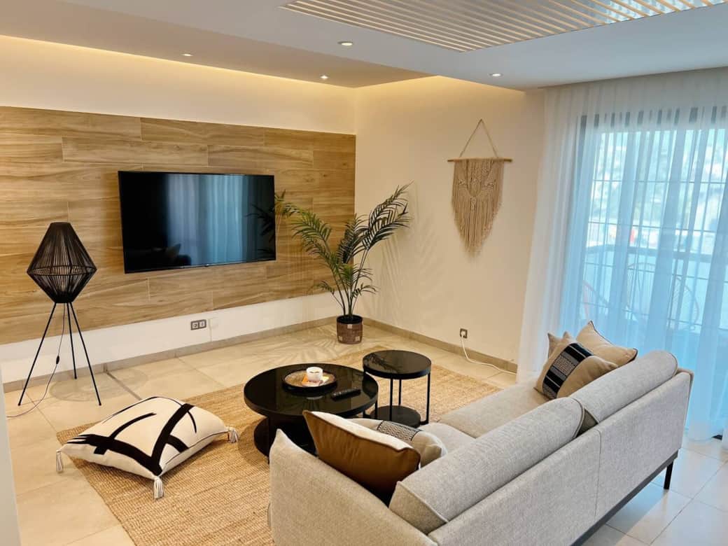 Relax and unwind in our inviting living room oasis, where natural colors and soothing textures create a serene retreat inspired by nature.