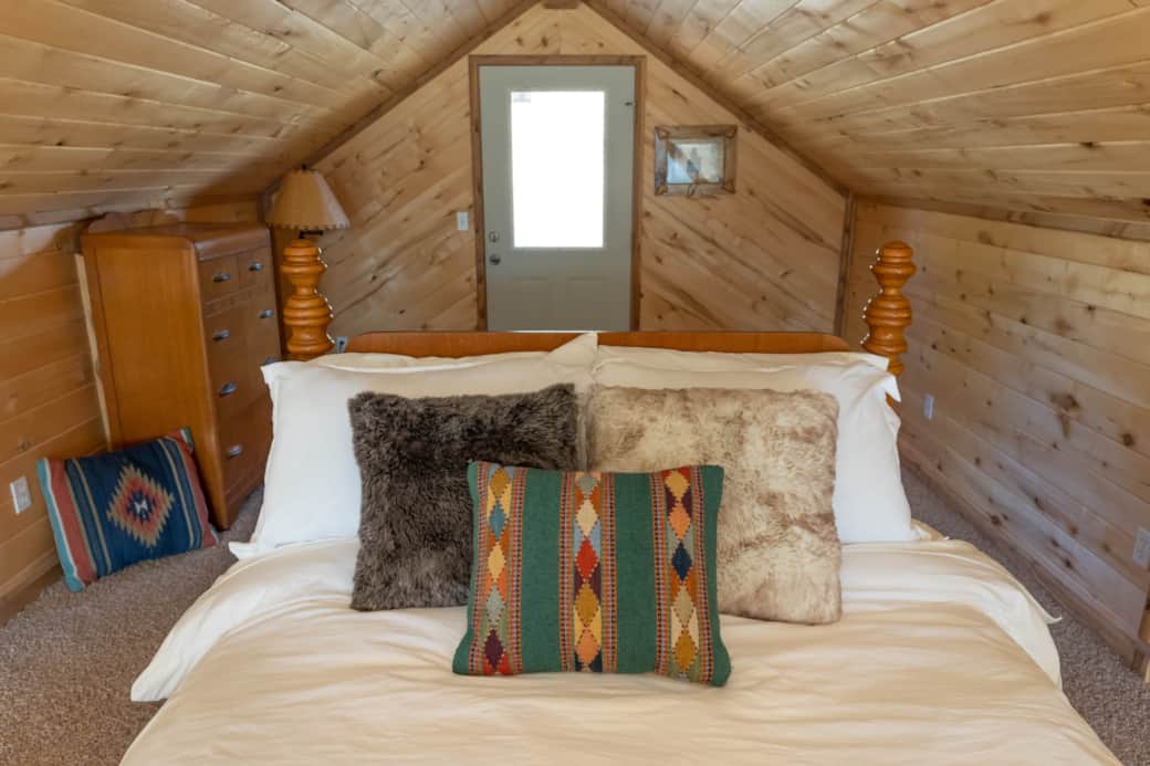 Spacious loft with double bed and private deck.