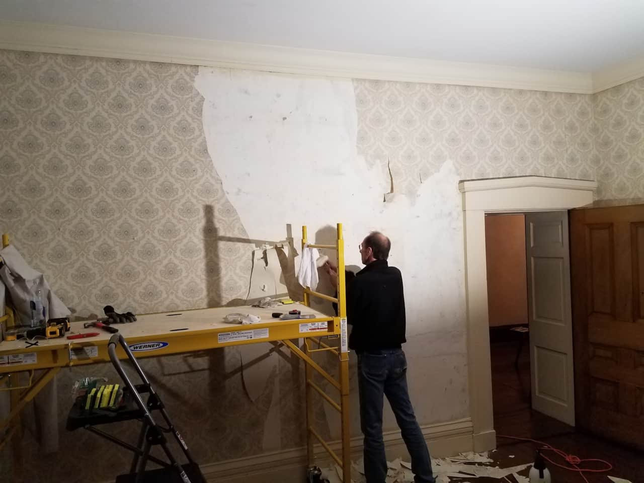 My brother helping to remove LOTS of wallpaper
