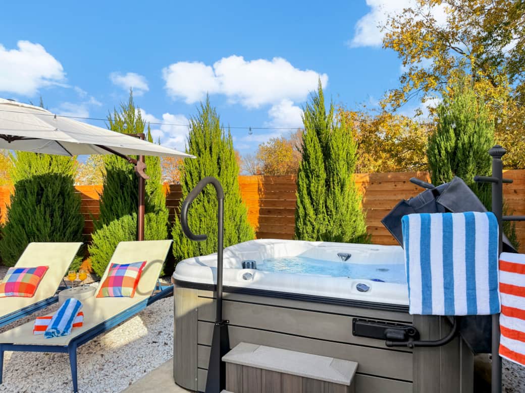 Hot tub + sun lounge area Hot tub + sun lounge area