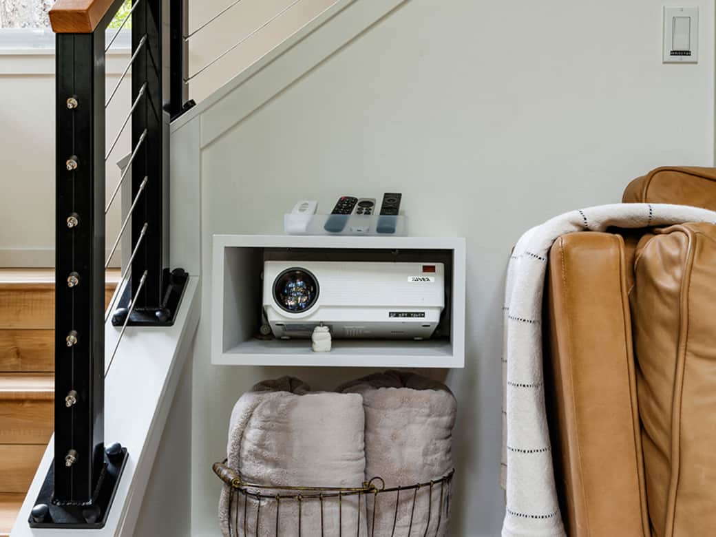 Projector unit nestled into a custom shelf Projector unit nestled into a custom shelf