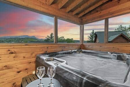 Enjoy the private hot tub with a spectacular view of the Smokey Mountains