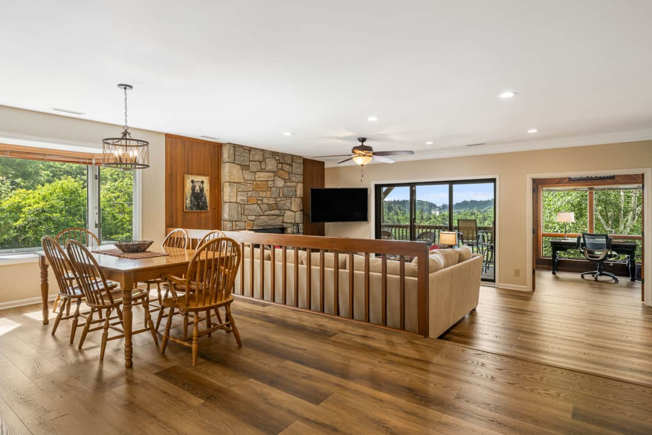 Dining room with seating for 8, with 2 additional bar seats in the kitchen