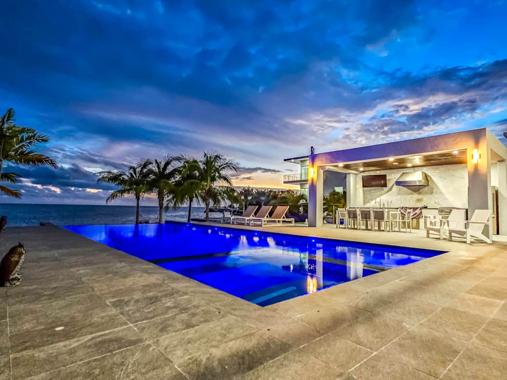 Twilight view infinity pool and dining area