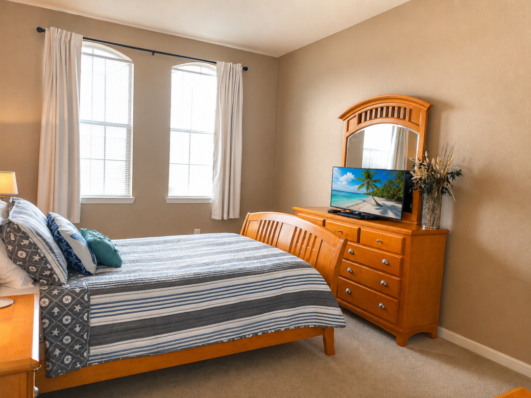 Master bedroom features a queen-sized bed and ensuite bath