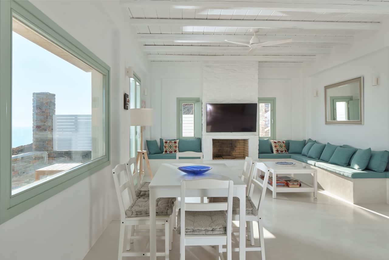 Inviting living and dining space with traditional fireplace