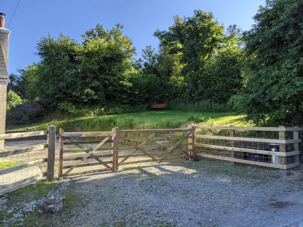 Gated driveway with space for 2-3 vehicles.