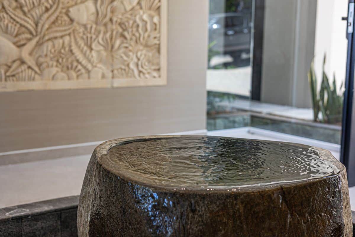 Balinese stone water feature at the entrance of Villa Sueño.