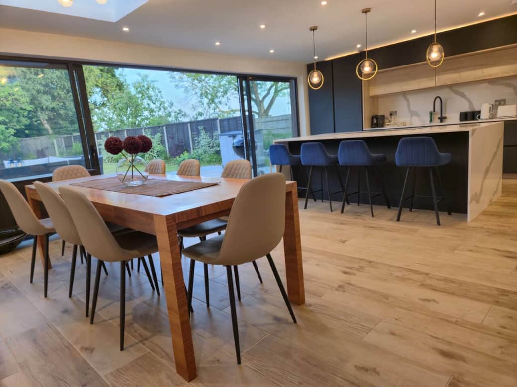 Open plan Kitchen Dining with seating for up to 12. Large sliding doors lead on to garden & Patio.