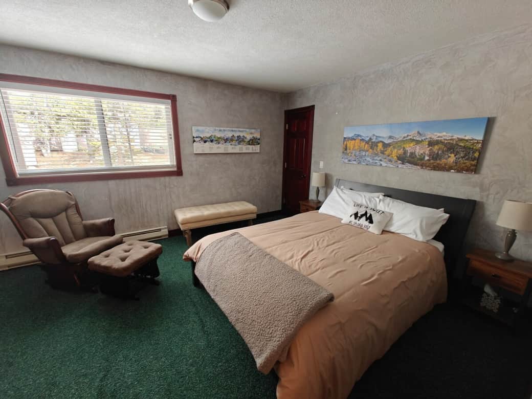 Master bedroom with Queen size bed and attached full bathroom on main level // 14'er room