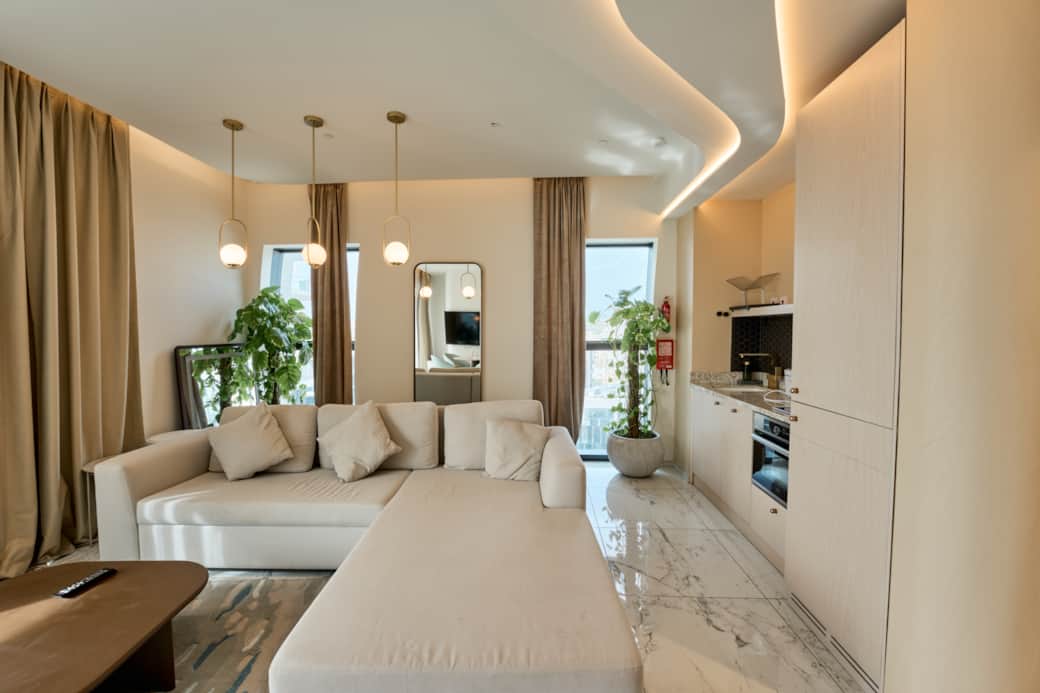 Stylish Living Room with Designer Lighting and Kitchenette Stylish Living Room with Designer Lighting and Kitchenette