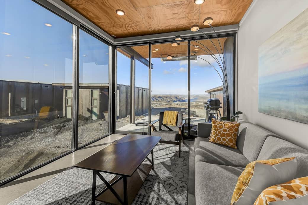 Living room and floor to ceiling windows. The view is spectacular.